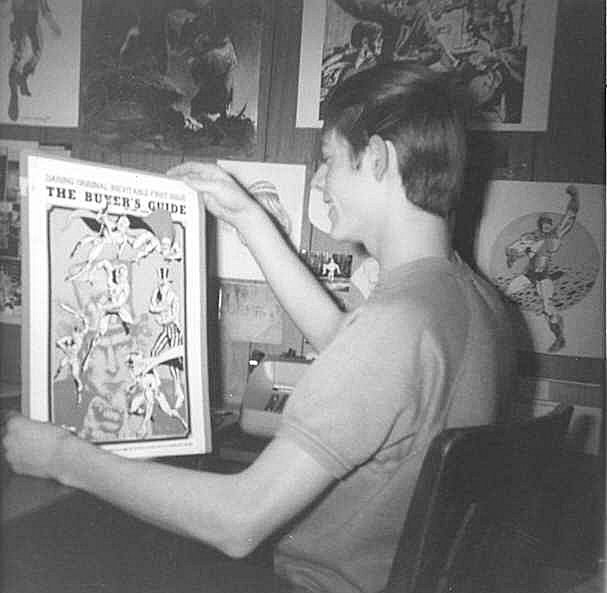 Alan Light holds the original John G. Fantucchio artwork for the cover of The Buyer's Guide #1.